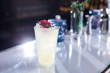 Cocktail with cranberries on the bar
