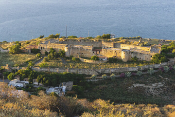 Obraz premium Panoramic view on European medieval fortress on top of hill above Mediterranean sea. Historical heritage, ancient ruins, architecture. Travel destination.
