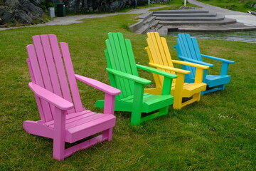 Multi coloured chairs on grass