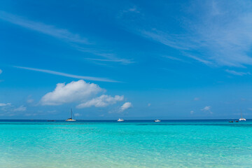 Boats on turquoise Ocean with White Sand blue Sky at Zanzibar Island, Tanzania