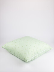 pillow in a cotton cover with a zipper on a white background