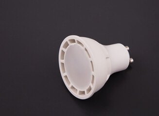 Electric bulb of LED. White on a black background.