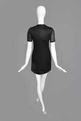 lifeless mannequin with black clothes isolated grey background studio