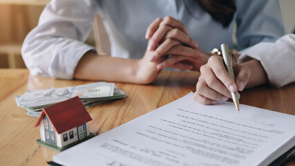 Real estate agent sign a contract documents agreement with customer to sign contract