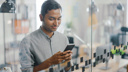 Portrait of Handsome Professional Indian Man Uses Mobile Phone, Writes Important Email. Successful...