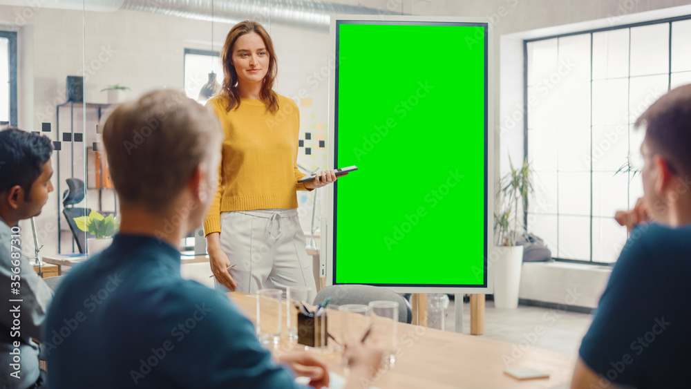Aufkleber female project manager holds meeting presentation for a team of developers. she shows green screen i