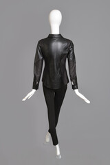 lifeless mannequin with black clothes isolated grey background studio