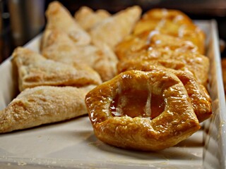 Freshly baked breads and pastries at a breakfast buffet