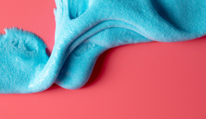 Blue slime isolated on pink background