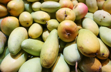 Mango on the counter in the market .