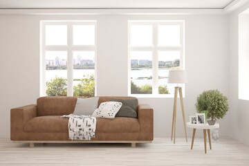 White living room with sofa and summer landscape in window. Scandinavian interior design. 3D illustration