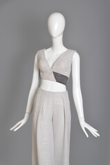 lifeless mannequin with blue beach dress isolated grey background studio