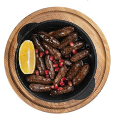 hunting sausages baked in a pan on a wooden board on a white background
