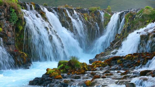 Splendid summer view of Bruarfoss Waterfall, secluded spot with cascading blue waters. Stunning outdoor scene of Iceland, Europe. Full HD video (High Definition).