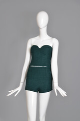 lifeless mannequin with blue beach dress isolated grey background studio