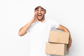 Delivery Arabian man isolated on blue background shouting with mouth wide open