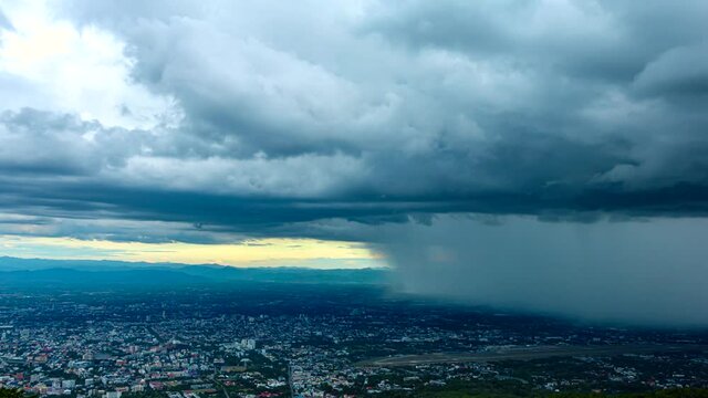 Time Lapse video 4k. Dark dramatic sky with heavy rain over Chiang mai city, Thailand.