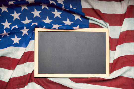 Black board with copy space above the American flag