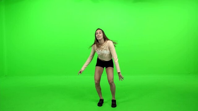 Professional hip-hop dancer performs over green screen.
