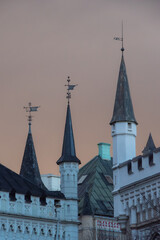 View to the towers of the Small Guild and the Great Guild in the Old Town of Riga under dramatic evening clouds