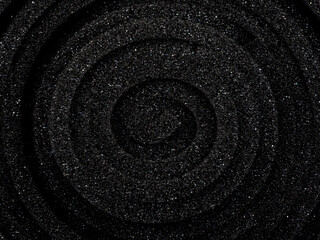 Fototapeta na wymiar macro photography of the surface of a rolled-up black sponge foam. Top view