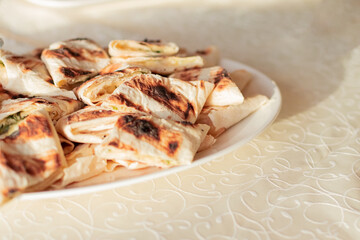 banquet canape with caviar soft focus cafe food photography on white plate and table cloth background
