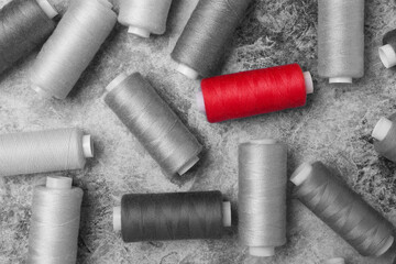 Back and white background with red thread.