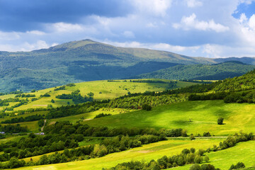 Mountain landscape with green pastures