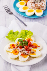 Boiled eggs on white plate
