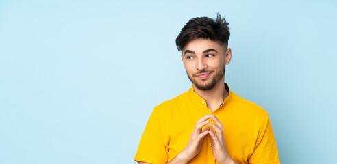 Arabian handsome man over isolated background scheming something