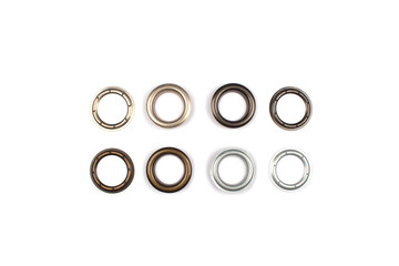 Set of brass multicoloured metal eyelets or rivets - curtains rings for fastening fabric to the...