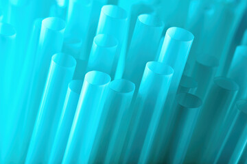 Blue plastic drinking straws. Macro close up view for background use