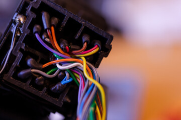 Closeup on colored electrical cables and wires. Soldering station