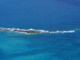 Medium wide aerial view of a strip of island in the Exuma Cays, Bahamas