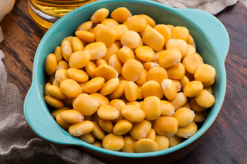 Tasty lupins and glass of beer. Beverage, legume.