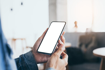 cell phone mockup image blank white screen.woman hand holding texting using mobile on desk at coffee shop.background empty space for advertise.work people contact marketing business,technology