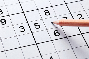Close up sudoku puzzle game and pencil