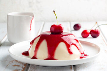 Delicious panna cotta with cherry sauce