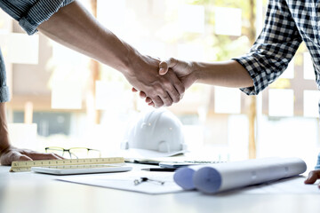Finishing up a meeting, Two engineer or architect meeting for project, handshake after consultation...