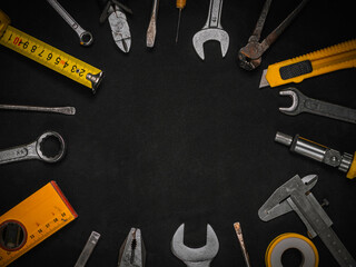 Background of various construction tools. Building tools repair set on black background. Top view. Copy Space