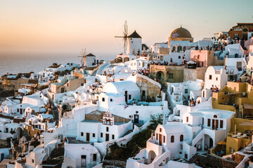 Santorini Island Oia Greece Europe, sunset at the white village of Oia Santorini with old blue and white Greek churches at dusk Santorini Greece © Fokke Baarssen