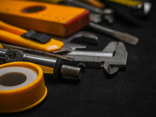 Fototapeta premium Background of various construction tools. Building tools repair set on black background. Copy Space