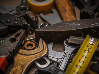 Building and measuring tools. Set of tools over a wood panel. Construction Tools With Blueprint On Wooden Desk