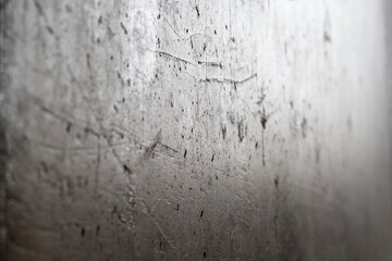 Concrete background with scratches, close-up, soft focus. Gray cement floor or textured wall. Copy space