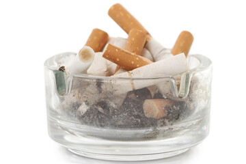 Bunch used cigarettes inside ashtray isolated white background