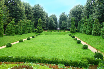 View of a beautiful green park with trees and lawn in Vienna, Austria.