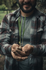 Obraz premium man with a flower in his hands