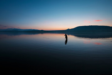 Lone fisherman on the lake. Russia. Ural.