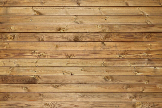 Dark wooden fence for abstract wooden backgrounds and textures. Wood horizontal panels with knots.