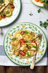 Ptitim or Israeli pasta with tomatoes and halloumi
